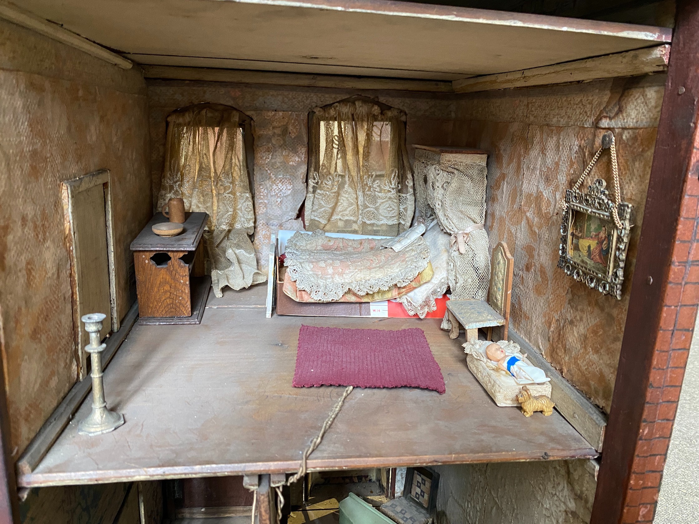 A back-opening furnished English dolls’ house, late 19th century, 74cm high